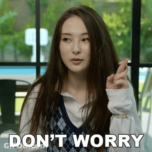 A Woman With Long Hair Is Making A Gesture With Her Fingers Crossed And The Words " Do N't Worry " Next To Her GIF