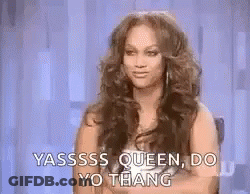 A Woman With Long Hair Is Sitting In A Chair With Her Arms Crossed And Saying Yassss Queen Do Yo Thang . GIF