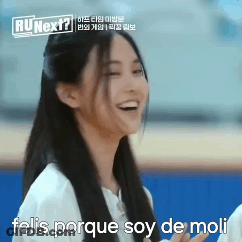 A Woman With Long Hair Is Smiling With The Words Felis Porque Soy De Moli Below Her GIF