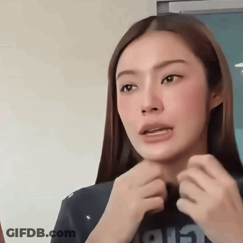 A Woman With Long Hair Is Wearing A Black Shirt That Says Air On It GIF