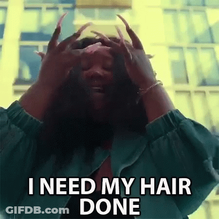 A Woman With Long Nails Is Holding Her Hair In Her Hands And Says `` I Need My Hair Done '' . GIF