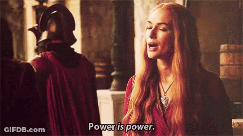 A Woman With Long Red Hair Is Saying Power Is Power GIF