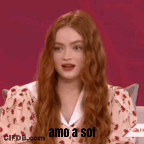 A Woman With Long Red Hair Is Smiling With The Words Amo A Sof Written Below Her GIF