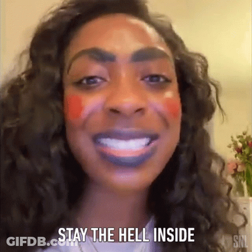 A Woman With Makeup On Her Face And The Words `` Stay The Hell Inside '' Written On Her Face . GIF