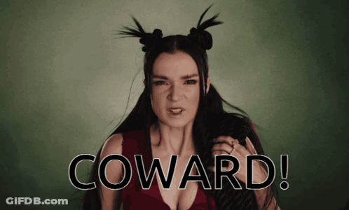 A Woman With Pigtails And The Word Coward On The Bottom Right GIF