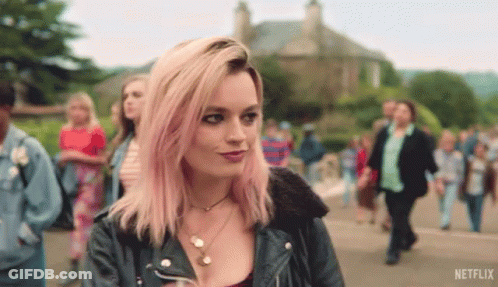 A Woman With Pink Hair And A Netflix Logo On The Bottom GIF