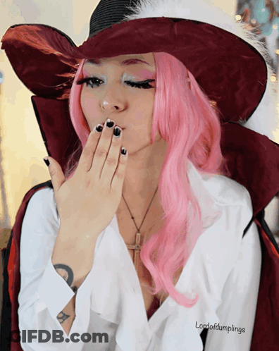 A Woman With Pink Hair And A White Shirt That Says Lordofdumplings On It GIF