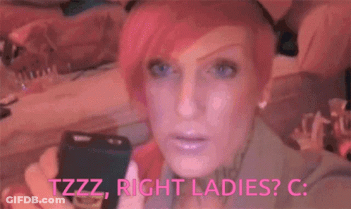 A Woman With Pink Hair And Blue Eyes Is Holding A Flashlight And Says Tzzz Right Ladies C. GIF