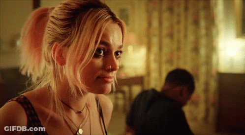 A Woman With Pink Hair Has A Nose Ring On Her Nose GIF