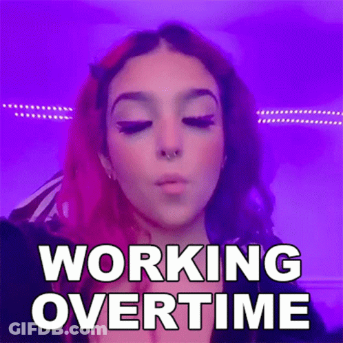 A Woman With Pink Hair Is Blowing A Kiss In Front Of A Purple Background With The Words `` Working Overtime '' . GIF