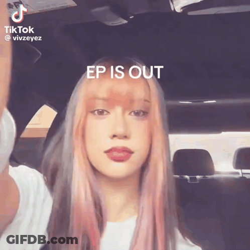 A Woman With Pink Hair Is Sitting In A Car With The Words Ep Is Out Above Her GIF