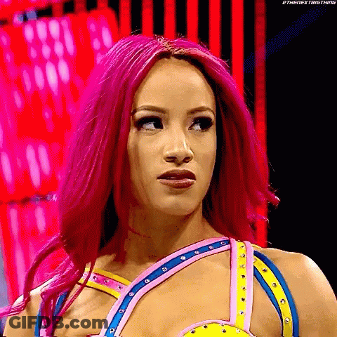 A Woman With Pink Hair Is Standing In Front Of A Red Background . GIF