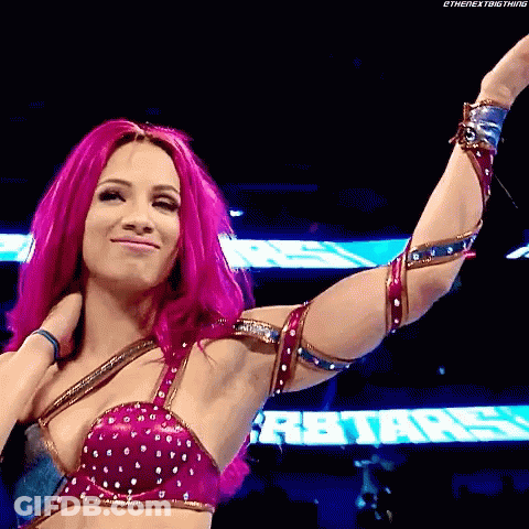 A Woman With Pink Hair Is Standing In Front Of A Sign That Says R Stars . GIF