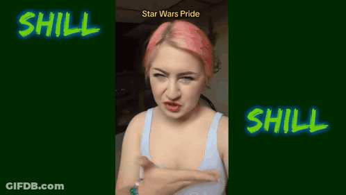 A Woman With Pink Hair Is Standing In Front Of A Sign That Says Shill GIF