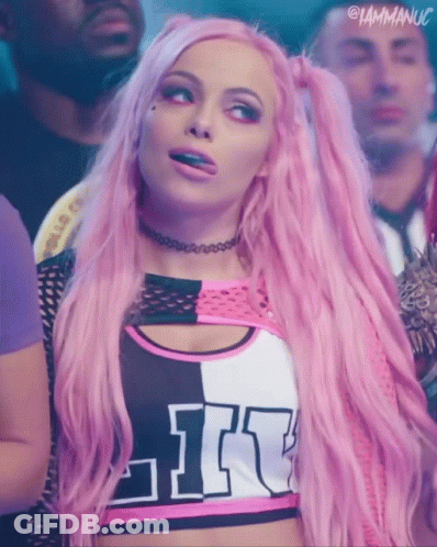 A Woman With Pink Hair Is Wearing A Top That Says Like On It GIF