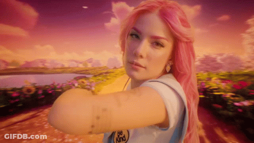A Woman With Pink Hair Is Wearing A White Shirt That Says Be Kind GIF