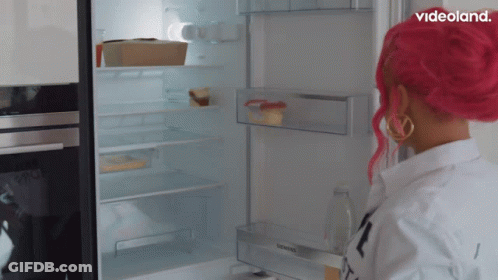 A Woman With Pink Hair Opens A Siemens Refrigerator Door GIF
