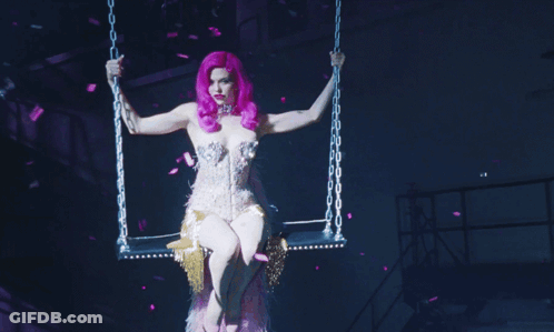 A Woman With Purple Hair And A Choker On Her Neck GIF