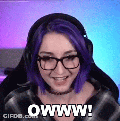 A Woman With Purple Hair And Glasses Says Owww GIF