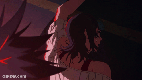 A Woman With Purple Hair Is Being Held By A Man GIF