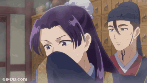 A Woman With Purple Hair Is Covering Her Face While A Man Looks On GIF