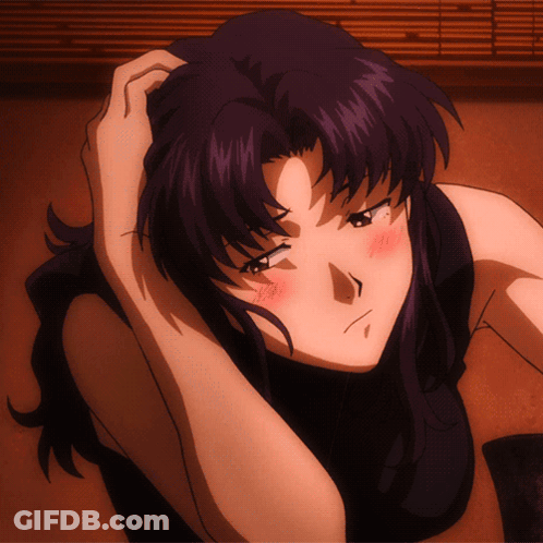 A Woman With Purple Hair Is Laying On The Floor With Her Hand On Her Head GIF