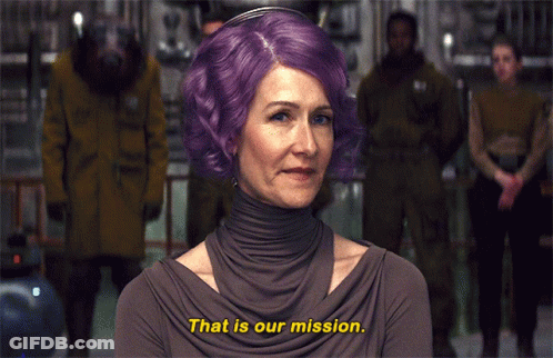 A Woman With Purple Hair Is Saying " That Is Our Mission " GIF