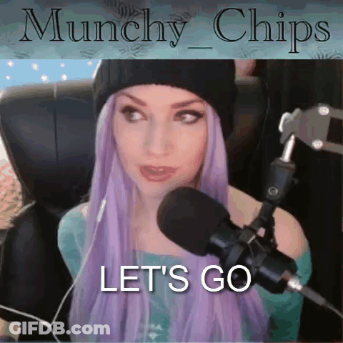 A Woman With Purple Hair Is Sitting In Front Of A Microphone With The Words " Let 'S Go " Above Her GIF