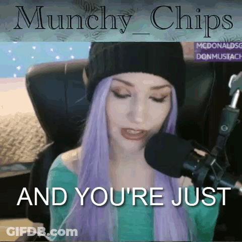 A Woman With Purple Hair Is Sitting In Front Of A Microphone With The Words " Munchies And You 'Re Just " GIF