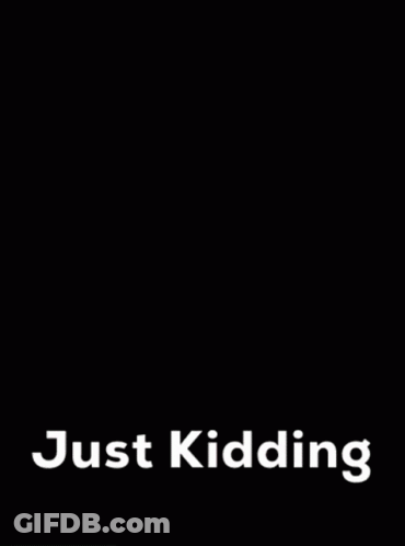 A Woman With Purple Hair Is Wearing A Black Dress And Pink Earrings And Says Just Kidding . GIF