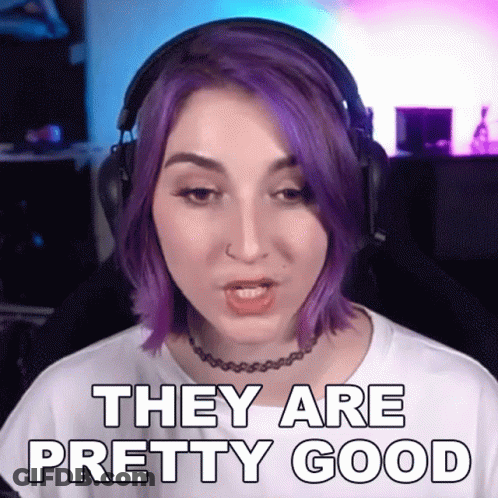 A Woman With Purple Hair Is Wearing Headphones And Saying They Are Pretty Good GIF