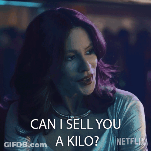 A Woman With Purple Hair Says " Can I Sell You A Kilo " In A Netflix Ad GIF