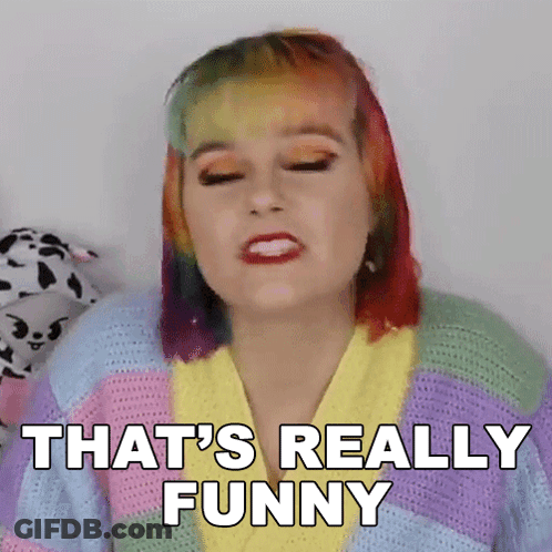 A Woman With Rainbow Hair Is Making A Funny Face And Saying That 'S Really Funny GIF