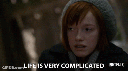 A Woman With Red Hair And A Gray Hat Says Life Is Very Complicated GIF