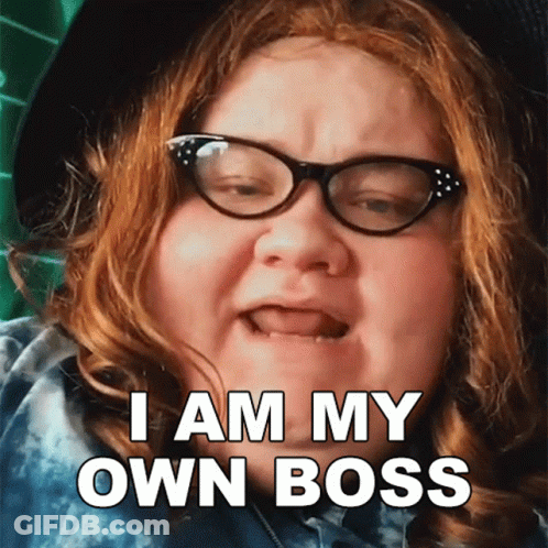 A Woman With Red Hair And Glasses Says I Am My Own Boss GIF