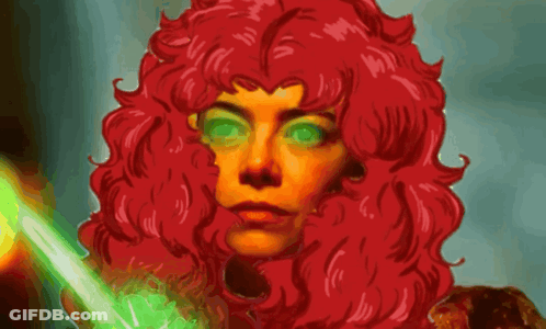 A Woman With Red Hair And Green Eyes Holds A Green Light GIF