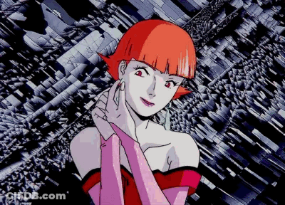 A Woman With Red Hair And Pink Gloves Stands In Front Of A Geometric Background GIF