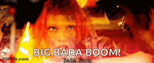 A Woman With Red Hair And The Words Big Bada Boom On The Bottom GIF