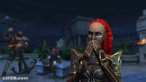 A Woman With Red Hair And White Paint On Her Face Is Covering Her Mouth GIF