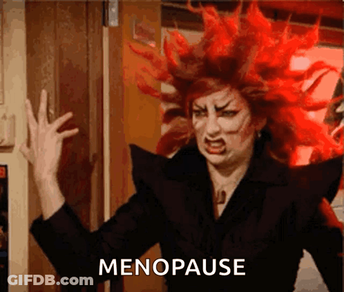 A Woman With Red Hair Has The Word Menopause Written On The Bottom GIF