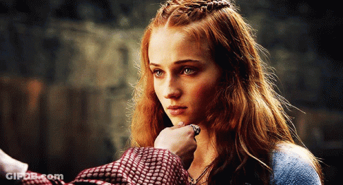 A Woman With Red Hair Is Being Touched By A Man With A Ring On Her Finger GIF