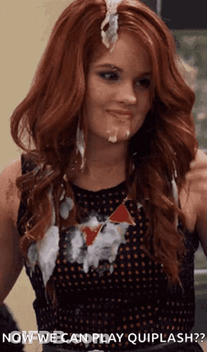 A Woman With Red Hair Is Covered In White Liquid And Says " Now We Can Play Quiplash " . GIF