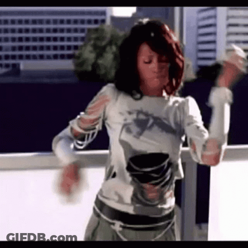 Woman With Red Hair Dancing On Balcony GIF