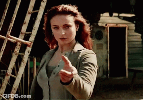 A Woman With Red Hair Is Giving A Thumbs Up GIF
