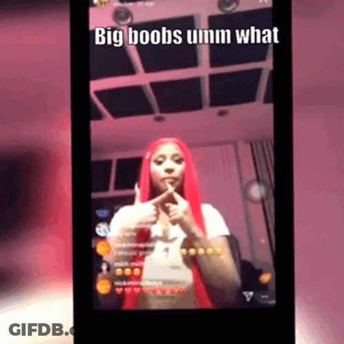 A Woman With Red Hair Is Giving A Thumbs Up And Says Big Boobs Umm What GIF