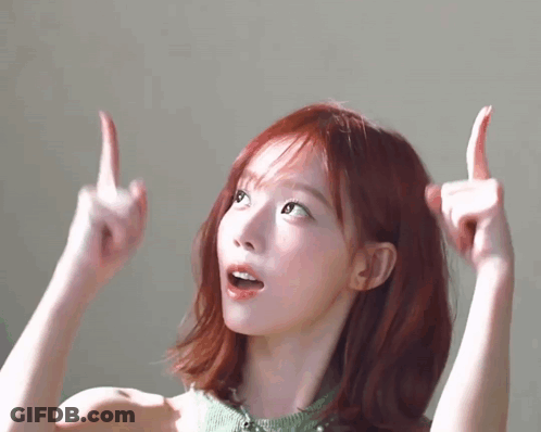 A Woman With Red Hair Is Giving The Middle Finger . GIF