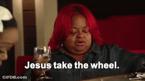 A Woman With Red Hair Is Holding A Glass Of Wine And Says Jesus Take The Wheel GIF