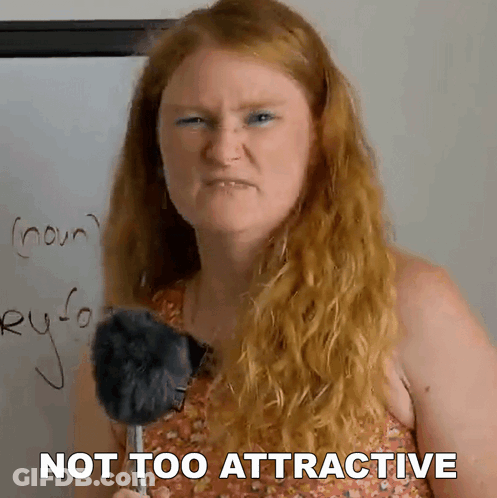 Red Haired Woman Holding Microphone Saying Not Too Attractive GIF
