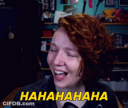 A Woman With Red Hair Is Laughing With The Words Hahahaha Written In Yellow GIF