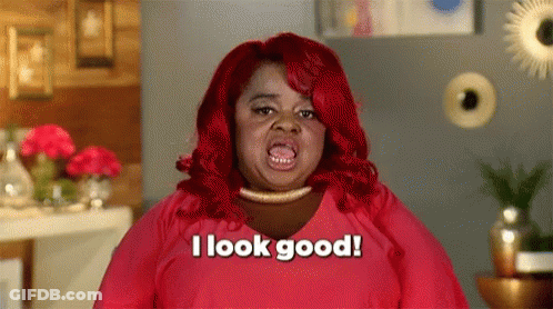 A Woman With Red Hair Is Saying `` I Look Good '' . GIF